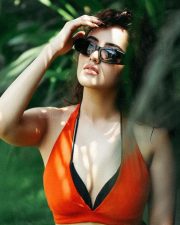 Bold and Hot Malvika Sharma in an Orange Bralette and Black Shorts Photos 02