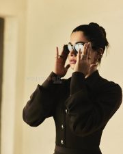 Boss Lady Rashmika Mandanna in a Black Metallic Buttoned Top and Long Flowing Skirt Photos 06