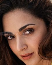 Breathtaking Actress Kiara Advani in a Yellow Triangle Bikini Photos 08