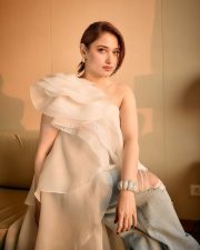 Breathtaking Tamannaah Bhatia in a Ruffled One Shoulder White Top with Ripped Denim Jeans Photos 02