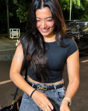Breezy Actress Rashmika Mandanna in a Black Crop T Shirt Grey Acid Wash Jeans Photos 01