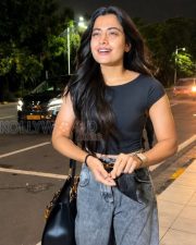 Breezy Actress Rashmika Mandanna in a Black Crop T Shirt Grey Acid Wash Jeans Photos 03