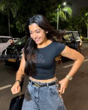 Breezy Actress Rashmika Mandanna in a Black Crop T Shirt Grey Acid Wash Jeans Photos 04