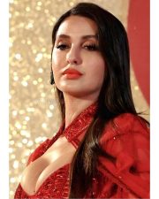Busty Nora Fatehi in a Red Saree with Cleavage Revealing Neckline Photos 04