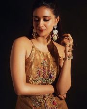 Captivating Actress Keerthy Suresh in a Gold Metallic Embroidered Spaghetti Dress Photos 01