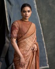 Captivating Actress Keerthy Suresh in a Peach Embroidered Saree Photos 03