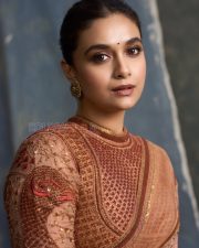Captivating Actress Keerthy Suresh in a Peach Embroidered Saree Photos 05