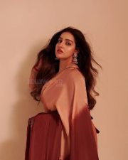 Captivating Actress Malavika Menon in a Maroon Crop Top and White Skirt Photos 04