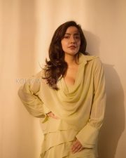 Captivating Actress Neha Sharma in a Pale Yellow Ruffled Cowl Neck Dress Photos 01