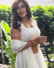 Charming Actress Malavika Sharma in a White Pearl Embellished Crop Blouse with White Saree Photos 04