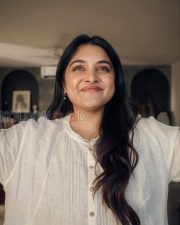 Charming Actress Nivetha Thomas in a White Linen Kurta Photos 03