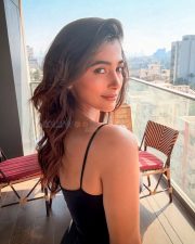 Charming Pooja Hegde in a Black and White Pleated Dress Pictures 01