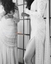 Charming Pooja Hegde in a White Thigh Slit Saree Monochrome Pictures01