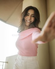 Charming Raashi Khanna in a Pink Knitted Off Shoulder Sweatshirt with a White Formal Pants Photos 02