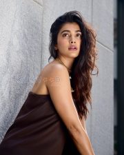 Chic Actress Pooja Hegde in a Dark Chocolate Brown Strapless Bandeau Crop Top Wide Leg Satin Trousers Photos 01