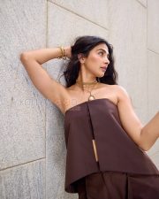 Chic Actress Pooja Hegde in a Dark Chocolate Brown Strapless Bandeau Crop Top Wide Leg Satin Trousers Photos 02