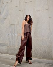 Chic Actress Pooja Hegde in a Dark Chocolate Brown Strapless Bandeau Crop Top Wide Leg Satin Trousers Photos 04