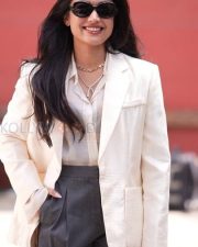 Chic Actress Rashmika Mandanna in a Cream Blazer and Grey Wide Leg Trousers Photos 02