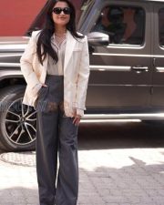 Chic Actress Rashmika Mandanna in a Cream Blazer and Grey Wide Leg Trousers Photos 06