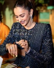 Chic Rakul Preet Singh in a Heavily Embellished Dark Blue Pre Draped Saree Outfit Photos 02