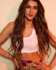 Confident Actress Kriti Sanon in a White Crop Top And Floral Pants Photos 01