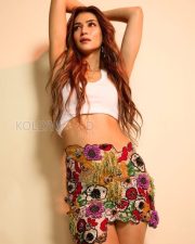 Confident Actress Kriti Sanon in a White Crop Top And Floral Pants Photos 02