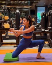 Confident Actress Rakul Preet Singh in a Blue Sports Bra And Leggings Photos 02