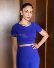 Confident Actress Rakul Preet Singh in a Royal Blue Athletic Crop Top and Leggings Photos 03