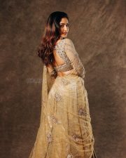 Coolie Actress Reba Monica John in a Golden Outfit Photos 01
