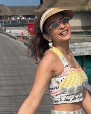 Cute Rakul Preet Singh in a Yellow and White Printed Bralette Top and Mini Skirt Pictures 02
