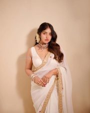 Dazzling Actress Malavika Menon in an Off Shoulder Saree with Ornate Necklace Photos 06