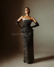 Dazzling Malavika Mohanan in a Black Embellished Strapless Gown with Sheer Black Opera Gloves Pictures 04