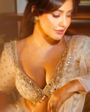 Dazzling Neha Sharma Cleavage in a Crystal Off White Silk Lehenga Photos 01