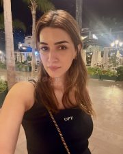 Delightful Actress Kriti Sanon in a White Eyelet Sundress Photos 03