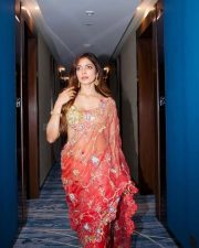 Desi Glamour Malavika Mohanan in a Sheer Coral Orange Saree with Floral Embroidery with a Gold Shimmer Blouse Photos 03 Desi Glamour Malavika Mohanan in a Sheer Coral Orange Saree with Floral Embroidery with a Gold Shimmer Blouse Photos 03