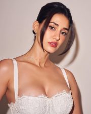 Dream Girl Disha Patani in a White Figure Hugging Lace Dress with Cleavage Photos 02