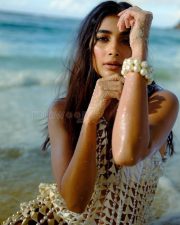 Dreamy Pooja Hegde in a Sheer Pearl Embellished Dress Over a White Two Piece Swimsuit Beach Vacation Photos 02