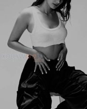 Dusky Babe Pooja Hegde in a White Crop Tank Top and Blue Pant Photos 01