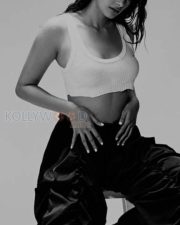 Dusky Babe Pooja Hegde in a White Crop Tank Top and Blue Pant Photos 01