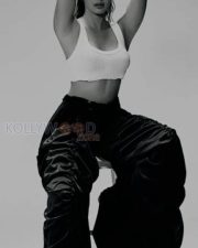 Dusky Babe Pooja Hegde in a White Crop Tank Top and Blue Pant Photos 04