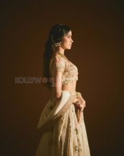 Elegant Actress Janhvi Kapoor in an Ivory Floral Lehenga Photos 03