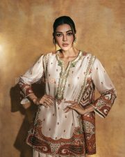 Elegant Actress Kajal Aggarwal in a Ivory Embroidered Ethnic Kurti Photos 01