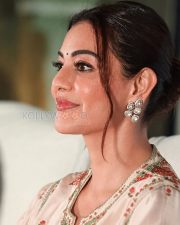 Elegant Actress Kajal Aggarwal in a White Embroidered Salwar Kameez Photos 02