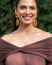 Elegant Actress Malavika Mohanan in a Brown Off Shoulder Ribbed Dress Photos 02