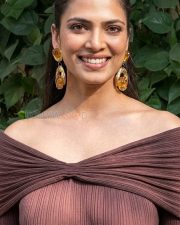 Elegant Actress Malavika Mohanan in a Brown Off Shoulder Ribbed Dress Photos 02