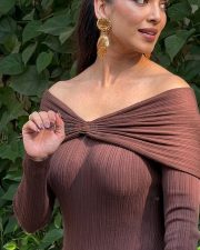 Elegant Actress Malavika Mohanan in a Brown Off Shoulder Ribbed Dress Photos 03