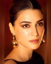 Elegant Kriti Sanon in a Sleek Black Dress with a Thigh Slit Pictures 03