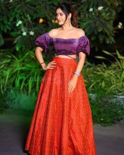 Elegant Payal Rajput in a Purple Off Shoulder Crop Top and Red Lehenga Photos 01