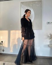 Elegant Rakul Preet Singh in a Black Long Sleeved Top with a Sheer Black Maxi Skirt Pictures 02