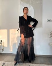 Elegant Rakul Preet Singh in a Black Long Sleeved Top with a Sheer Black Maxi Skirt Pictures 04